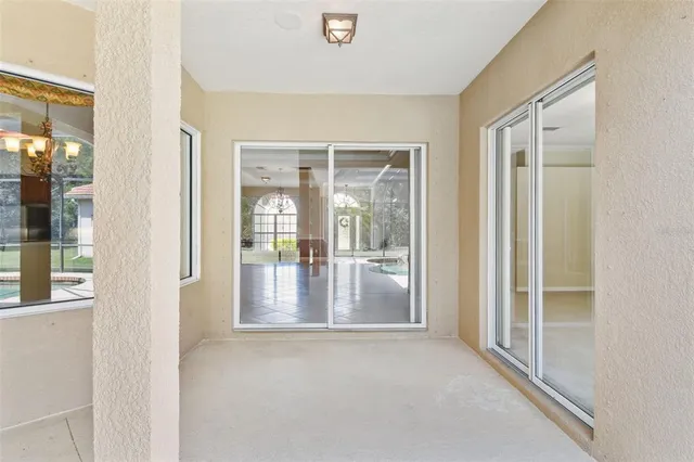 an aerial view of a residential houses with outdoor space and a lake view
