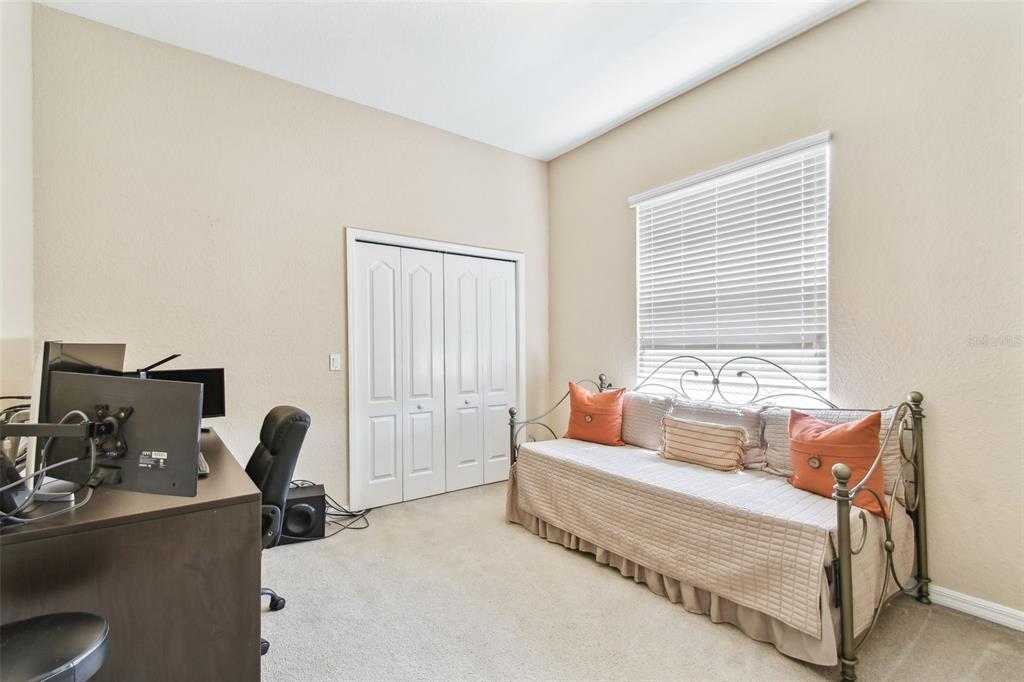 9008 Brookfield Terrace Bradenton, FL 34212 - Photo 45 of 81 a bedroom with furniture and a window