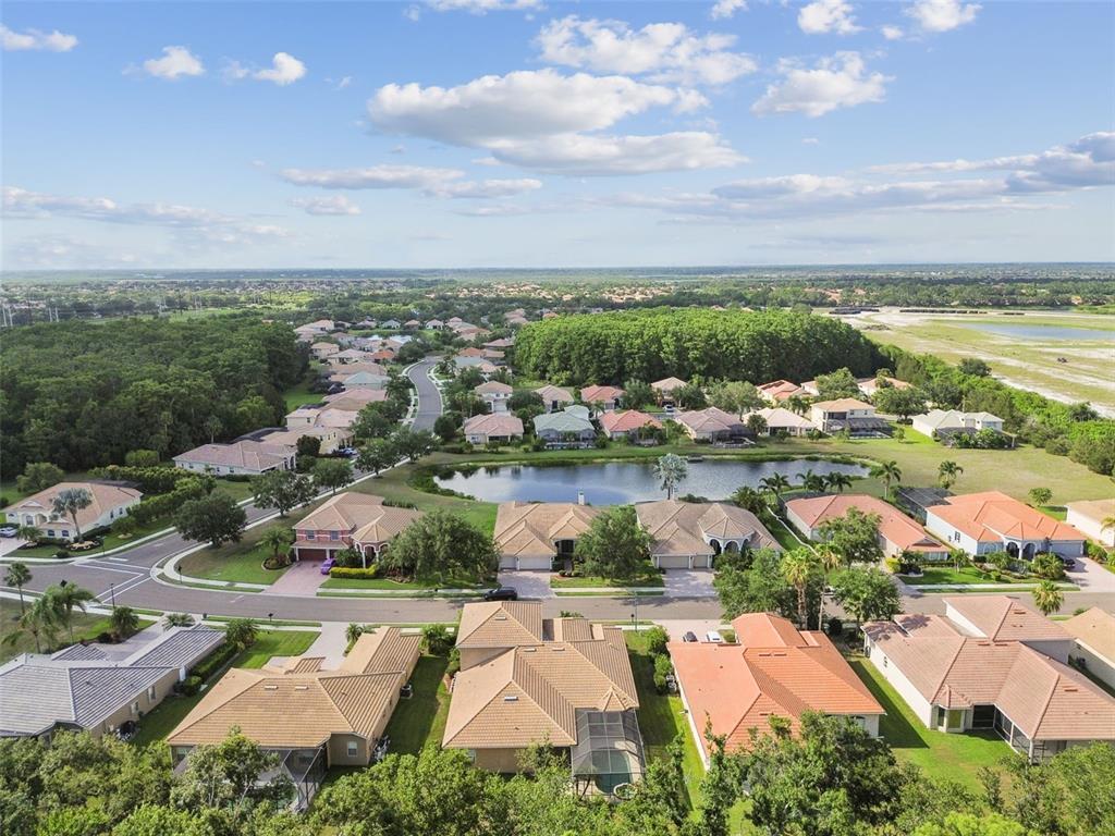 9008 Brookfield Terrace Bradenton, FL 34212 - Photo 70 of 81 an aerial view of residential houses with outdoor space and ocean view