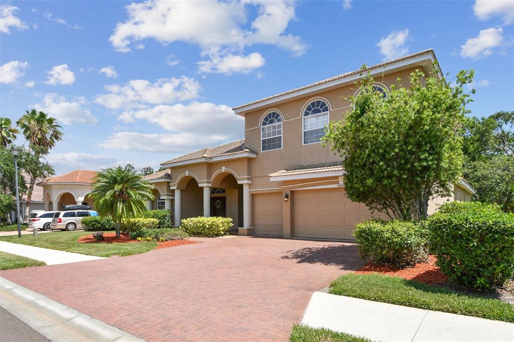 9008 Brookfield Terrace Bradenton, FL 34212 - Photo 7 of 81 a front view of a house with a yard and garage