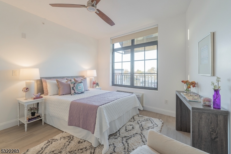 1026 Stuyvesant Avenue, Unit 403 Union, NJ 07083 - Photo 6 of 13 a bedroom with a bed and a window