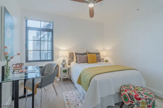 a bedroom with a bed and a table in it