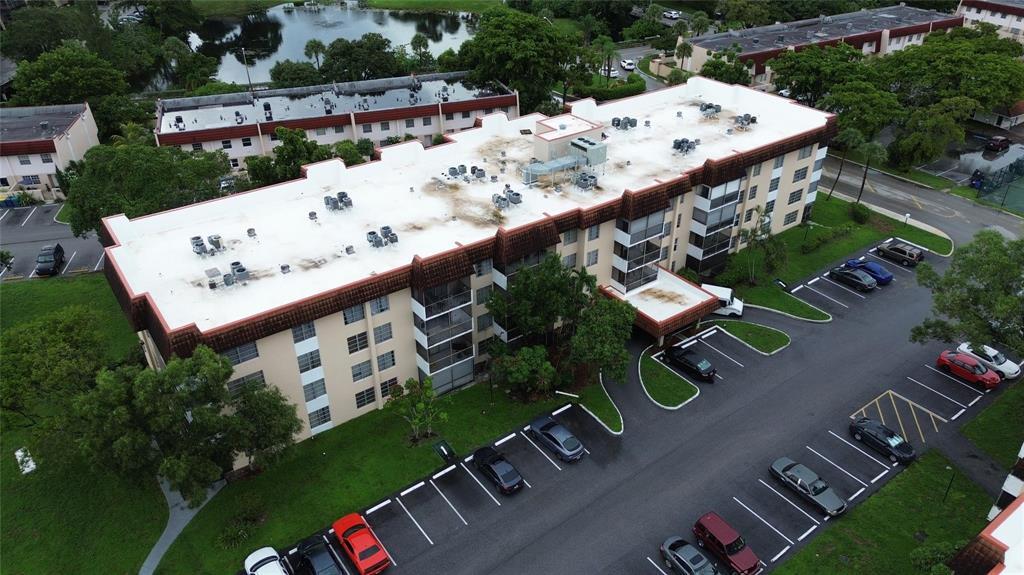 an aerial view of a chairs and table on the patio