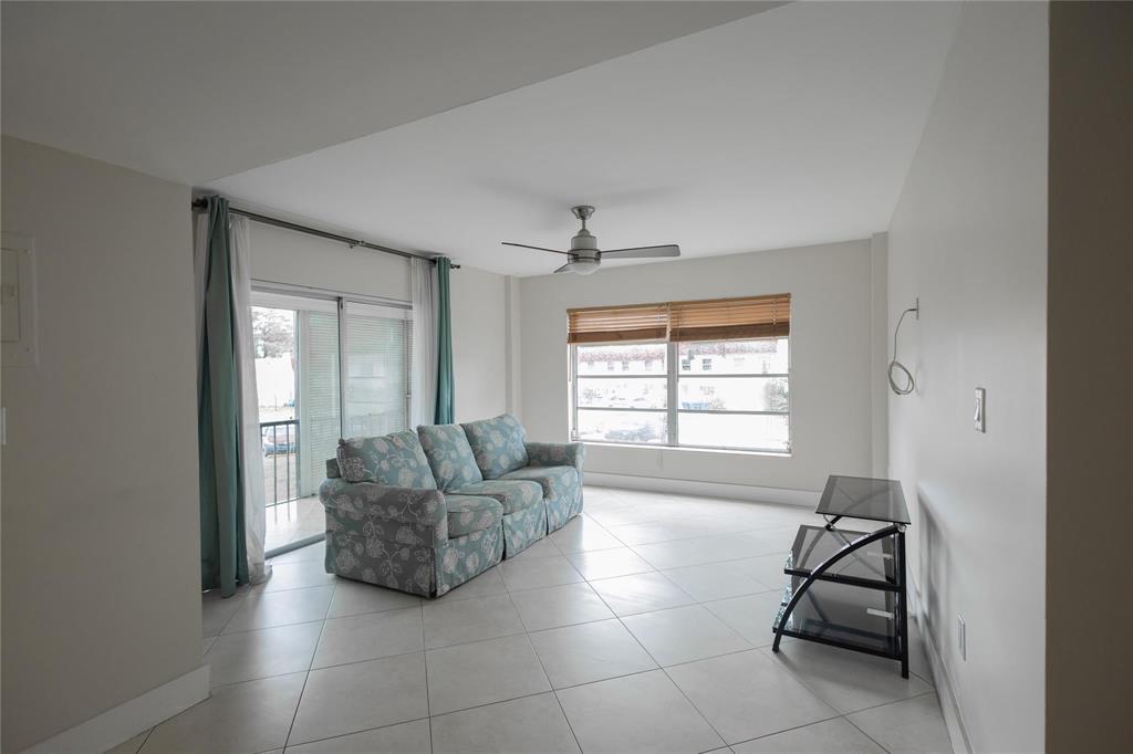 4152 Inverrary Drive, Unit 202 Lauderhill, FL 33319 - Photo 3 of 13 a living room with furniture and a window