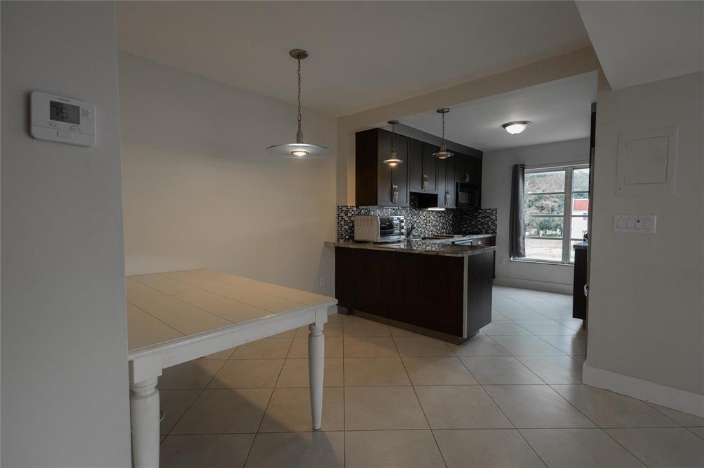 4152 Inverrary Drive, Unit 202 Lauderhill, FL 33319 - Photo 5 of 13 a kitchen with a sink and cabinets