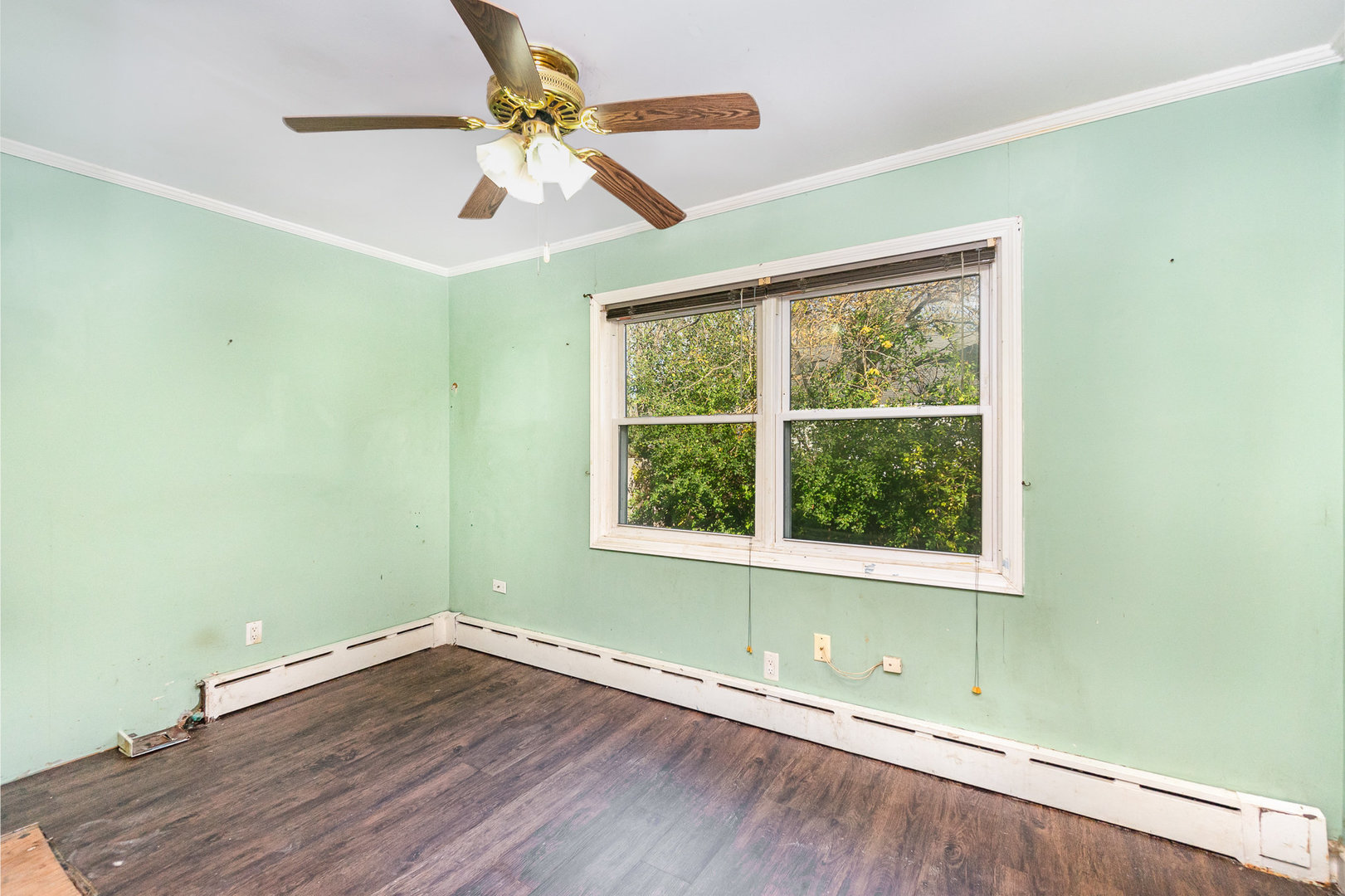 2936 Willow Road Homewood, IL 60430 - Photo 16 of 26 an empty room with wooden floor fan and windows