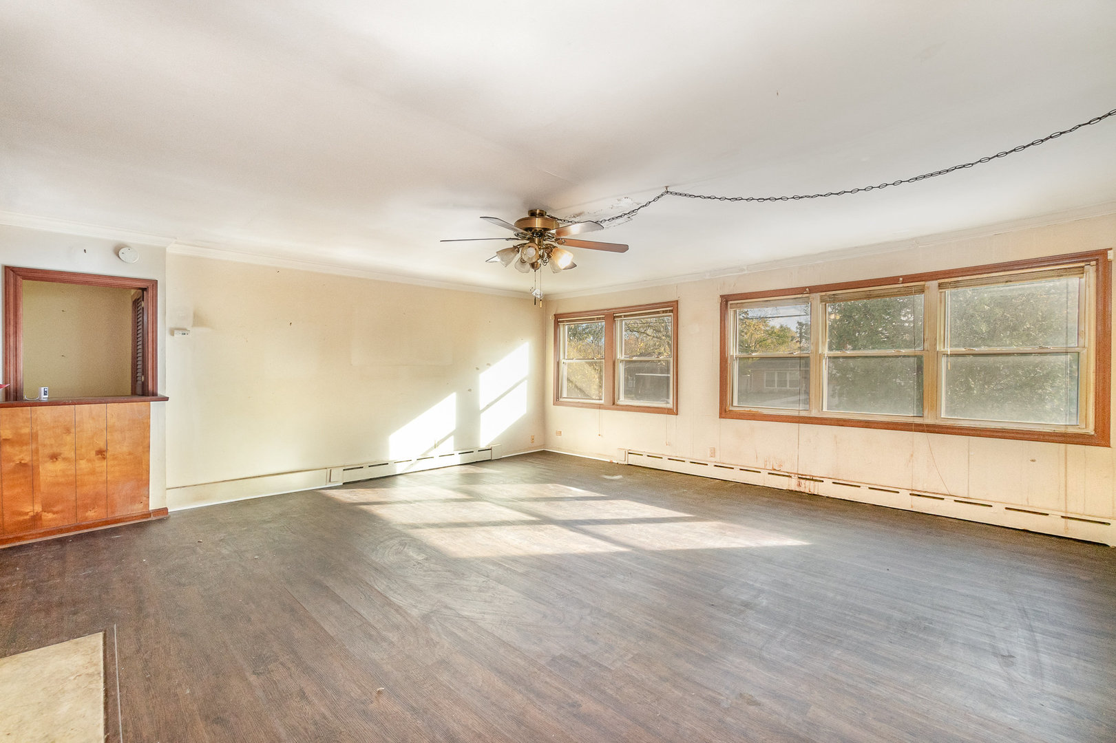 2936 Willow Road Homewood, IL 60430 - Photo 6 of 26 a view of an empty room with a window and wooden floor