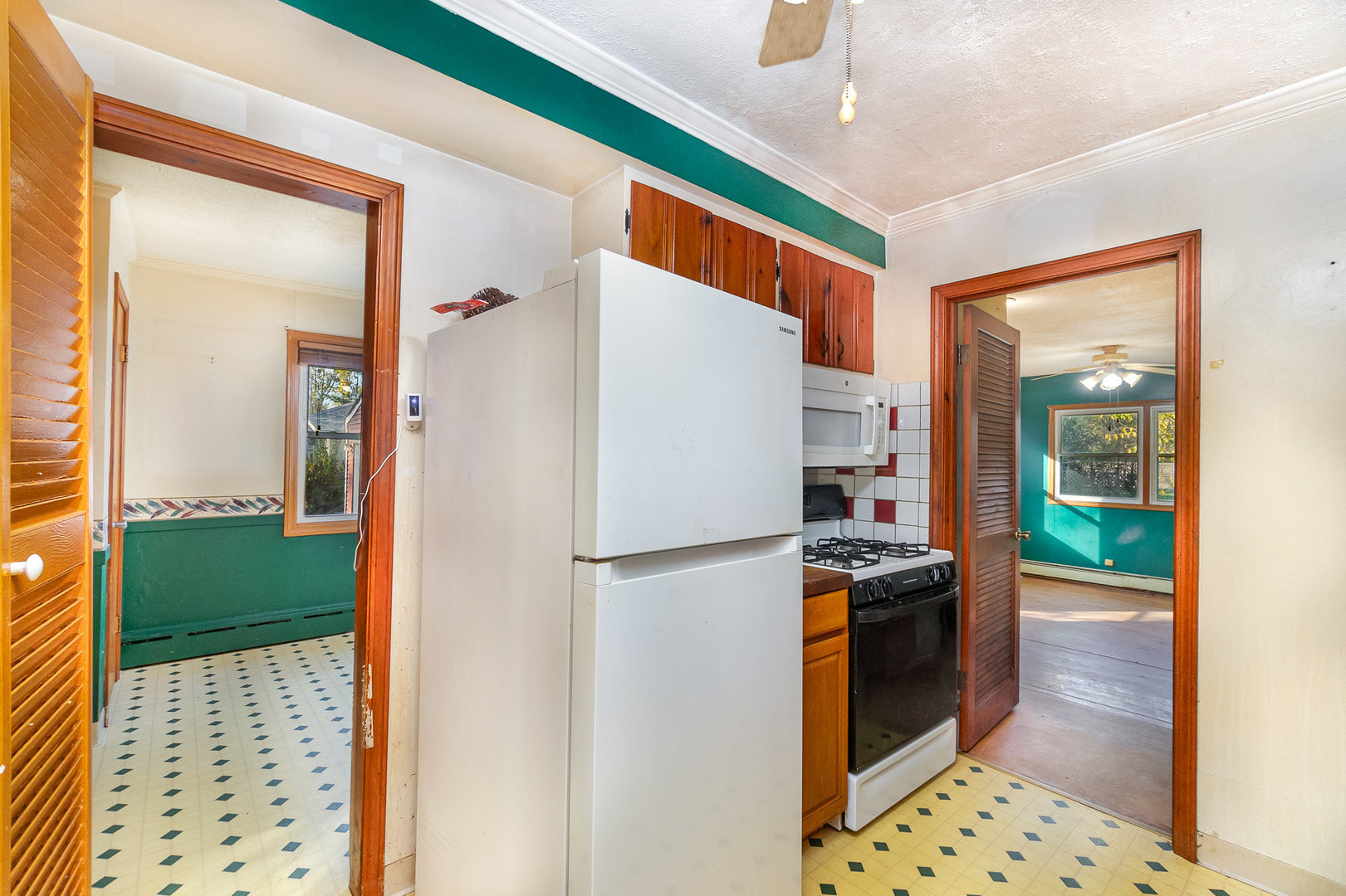 2936 Willow Road Homewood, IL 60430 - Photo 9 of 26 a kitchen with stainless steel appliances granite countertop a refrigerator and a sink