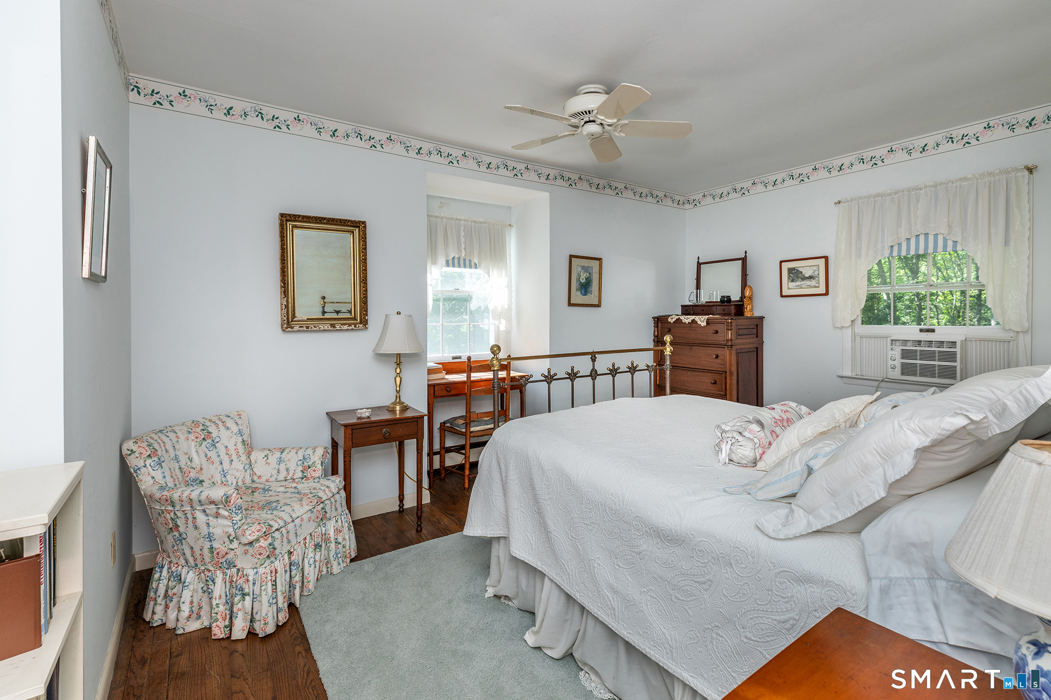 318 Romford Road Washington, CT 06777 - Photo 28 of 34 a bedroom with a bed and wooden floor
