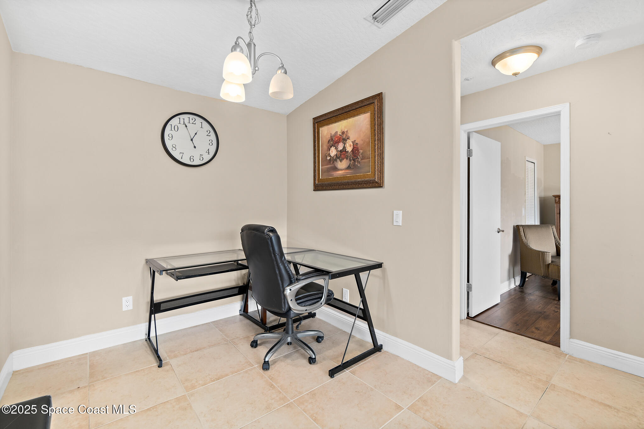 7667 North Wickham Road, Unit 222 Melbourne, FL 32940 - Photo 17 of 38 a view of a hallway with workspace and a window