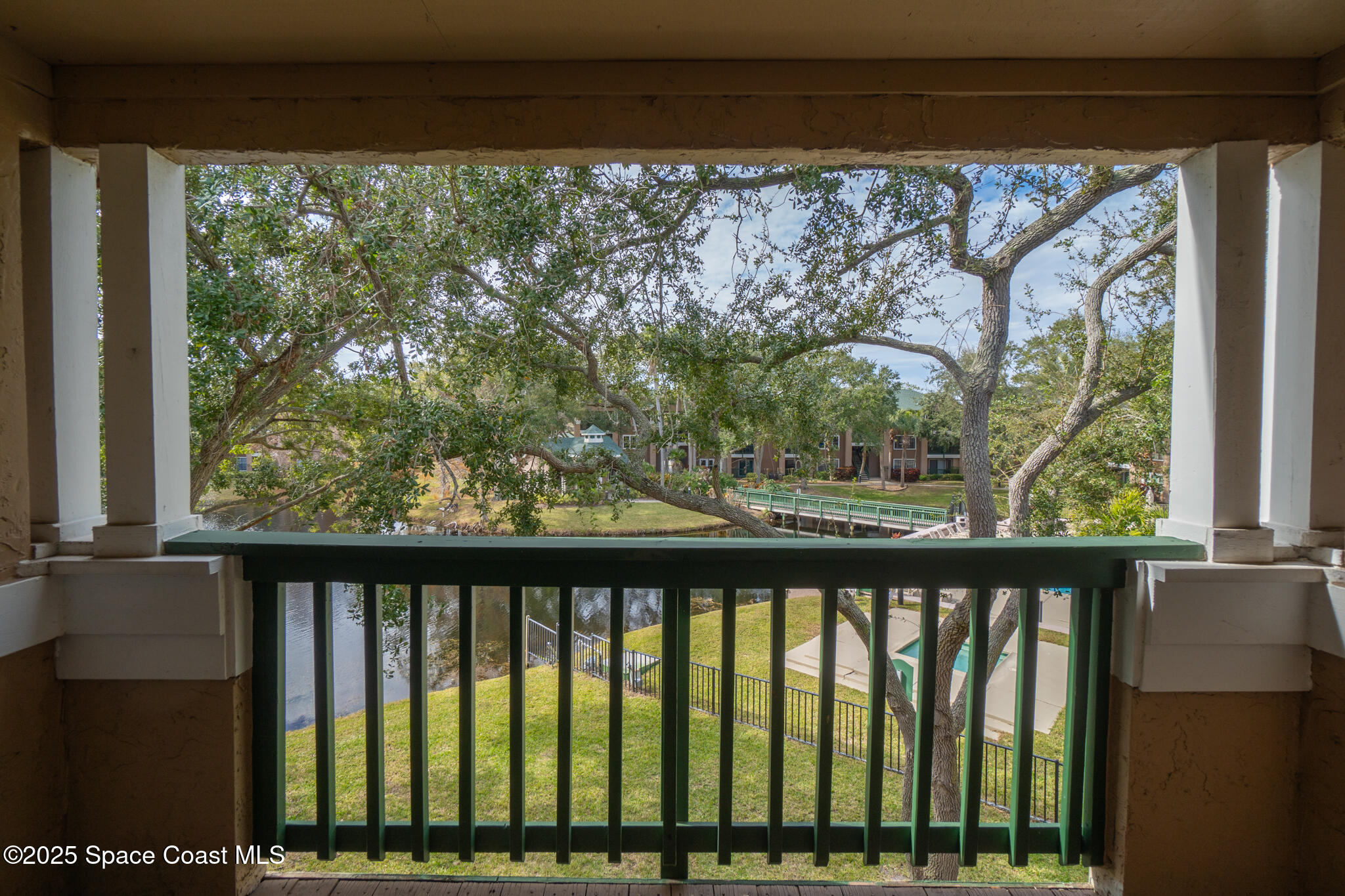 7667 North Wickham Road, Unit 222 Melbourne, FL 32940 - Photo 24 of 38 a view of a wooden fence