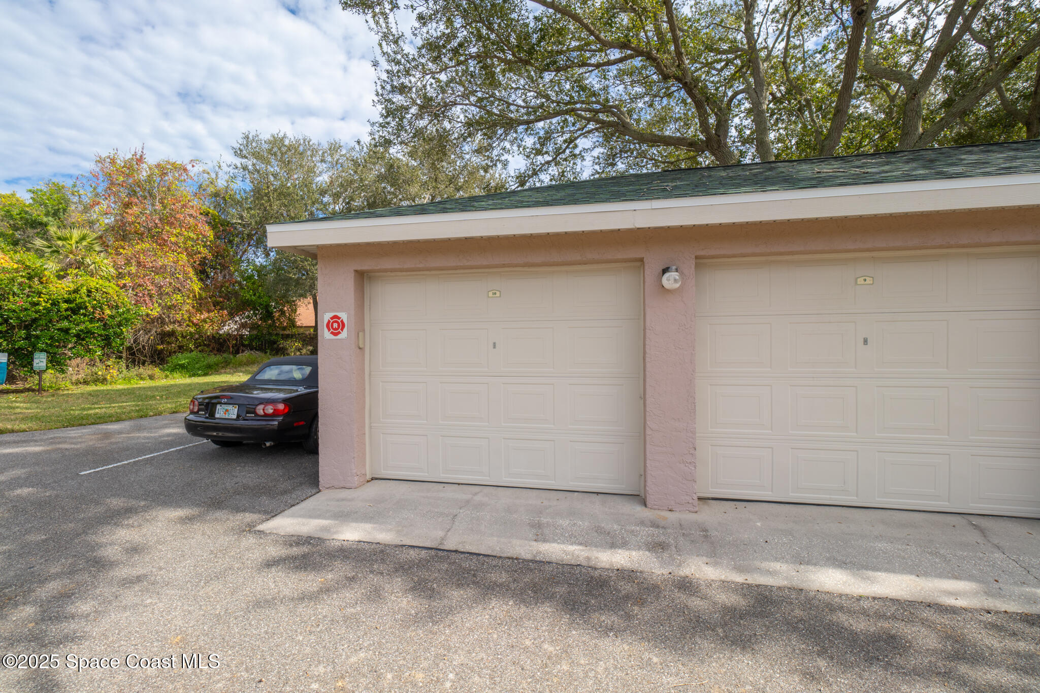 7667 North Wickham Road, Unit 222 Melbourne, FL 32940 - Photo 3 of 38 a view of a car parked in garage