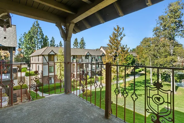 a view of street from balcony