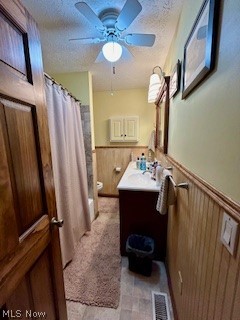 1465 Derby Road Waterford, OH 45786 - Photo 10 of 20 Bathroom featuring a textured ceiling, toilet, vanity, and ceiling fan