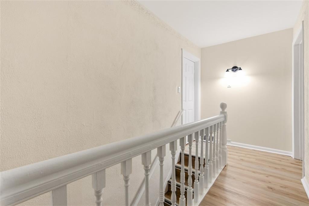13 Marchmont Street Pittsburgh, PA 15205 - Photo 15 of 29 a view of a hallway with wooden floor and a bathroom