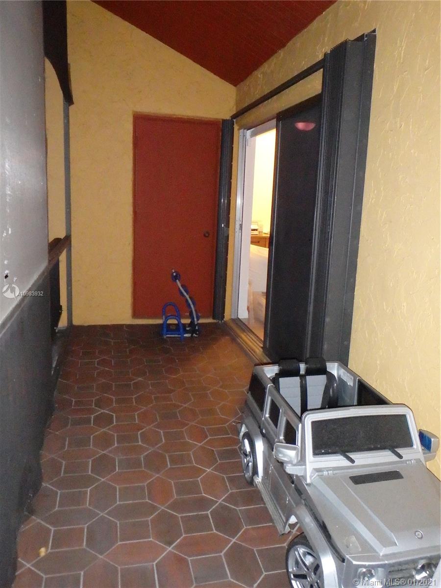 13735 Southwest 84th Street, Unit A Miami, FL 33183 - Photo 16 of 19 a room with gym equipment