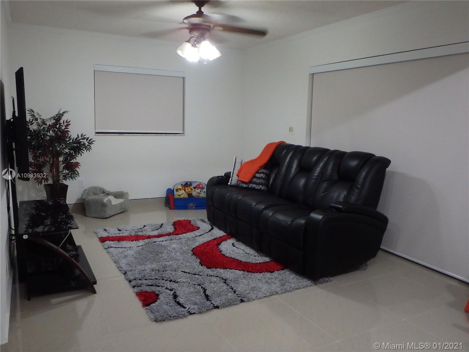 13735 Southwest 84th Street, Unit A Miami, FL 33183 - Photo 4 of 19 a bedroom with a bed window and dresser