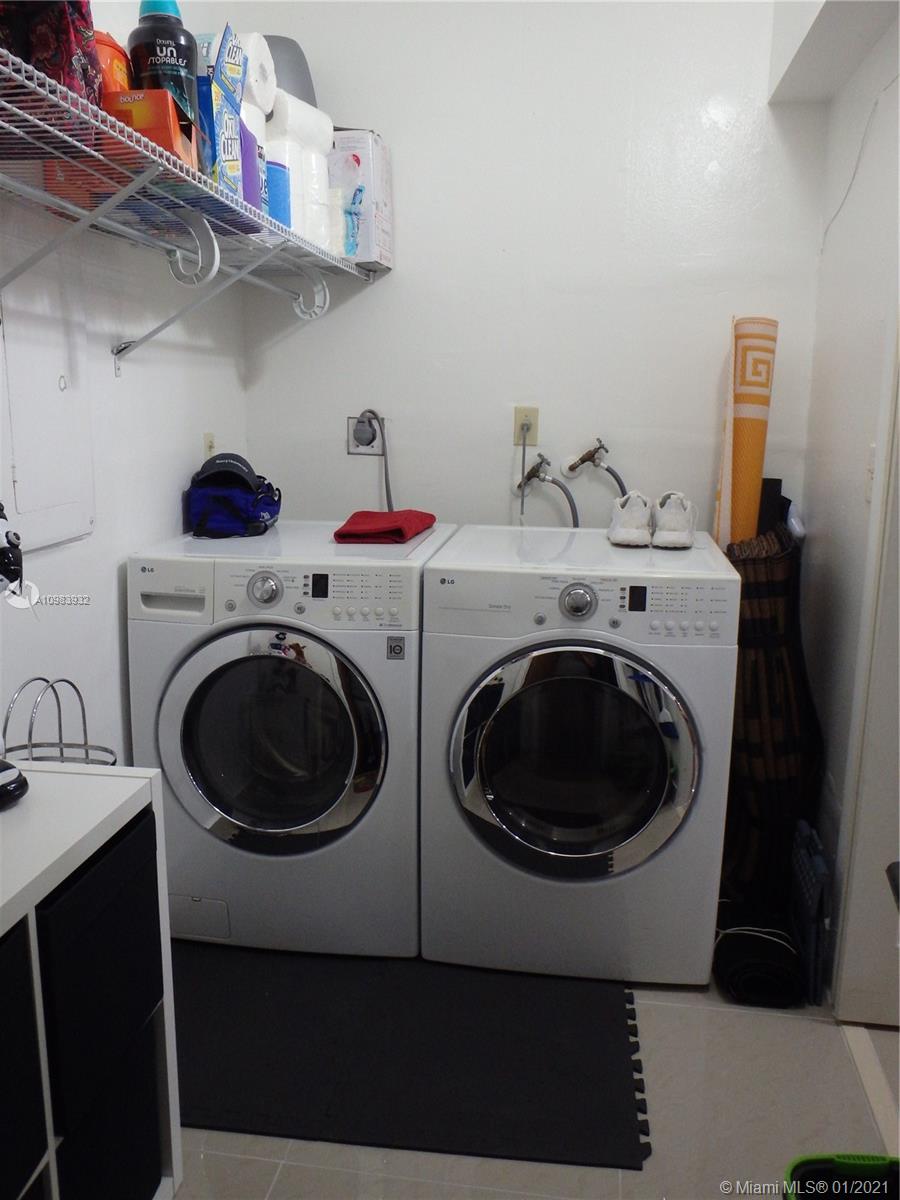 13735 Southwest 84th Street, Unit A Miami, FL 33183 - Photo 7 of 19 a utility room with dryer and washer