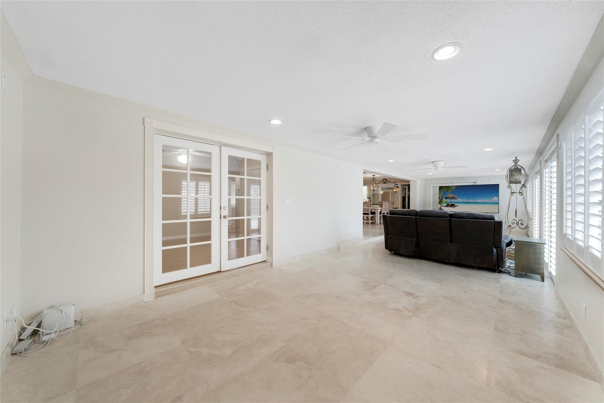 2061 North Conference Drive Boca Raton, FL 33486 - Photo 16 of 27 an empty room with furniture and windows