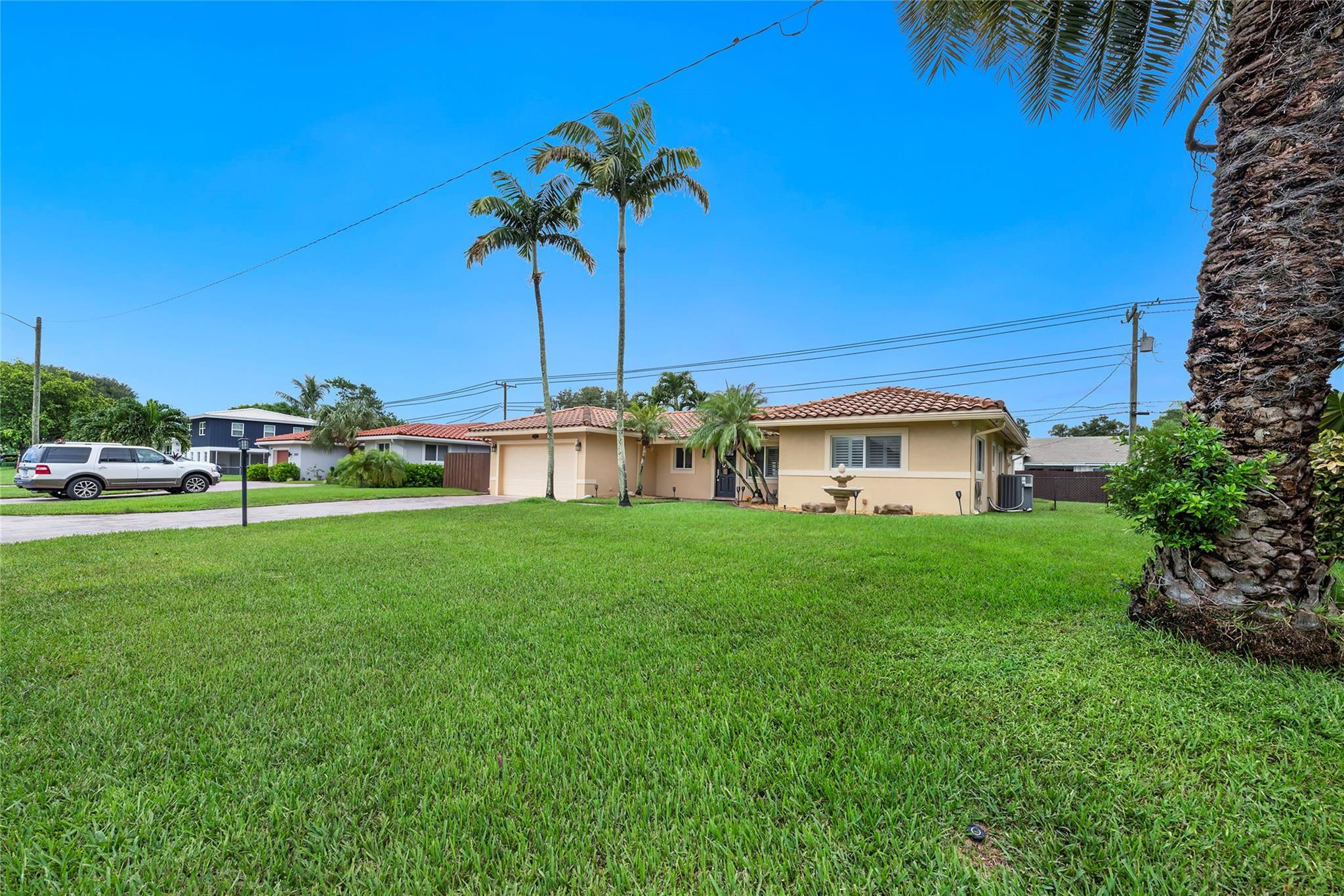 2061 North Conference Drive Boca Raton, FL 33486 - Photo 25 of 27 a front view of a house with garden