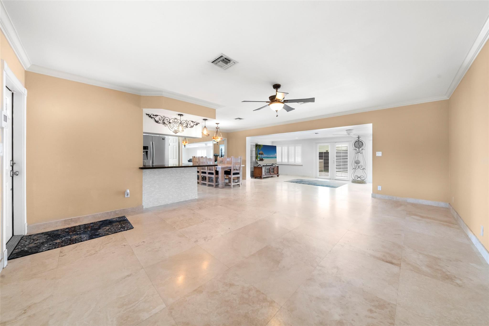2061 North Conference Drive Boca Raton, FL 33486 - Photo 6 of 27 a view of a livingroom with furniture and a flat screen tv