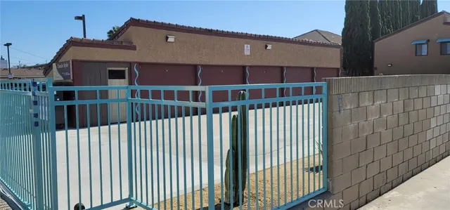 a balcony view with a black gate