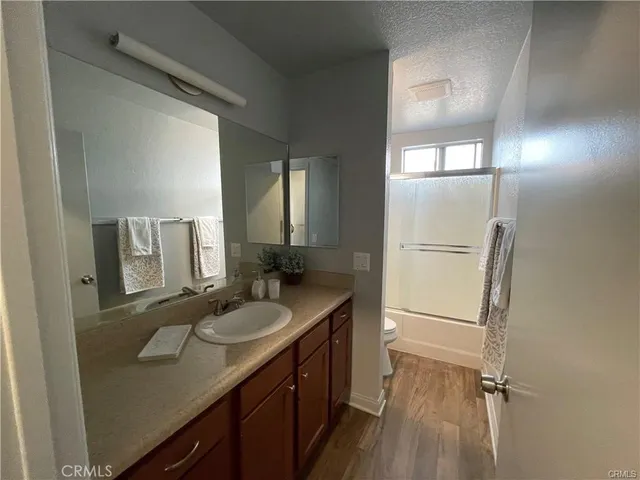 a bathroom with a sink a mirror and a shower