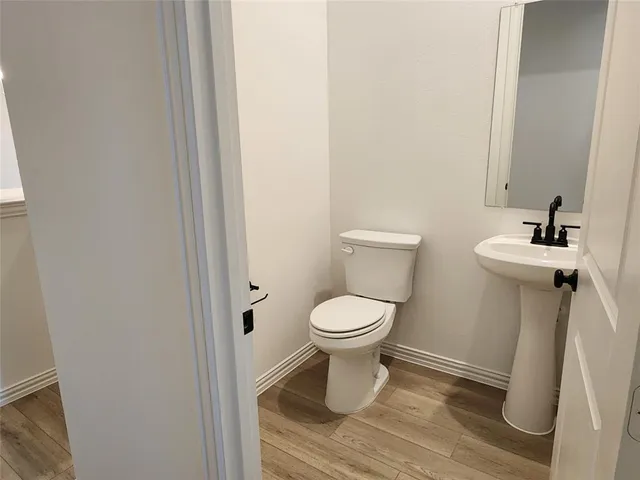 a bathroom with a toilet and a sink