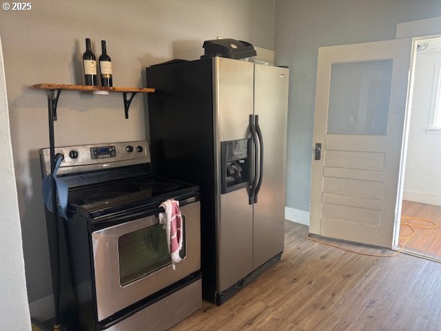 2800 10th Street Baker City, OR 97814 - Photo 11 of 23 a kitchen with a stove and a refrigerator