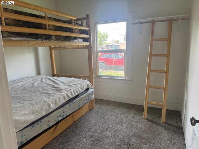 2800 10th Street Baker City, OR 97814 - Photo 20 of 23 a bedroom with a bed and a window