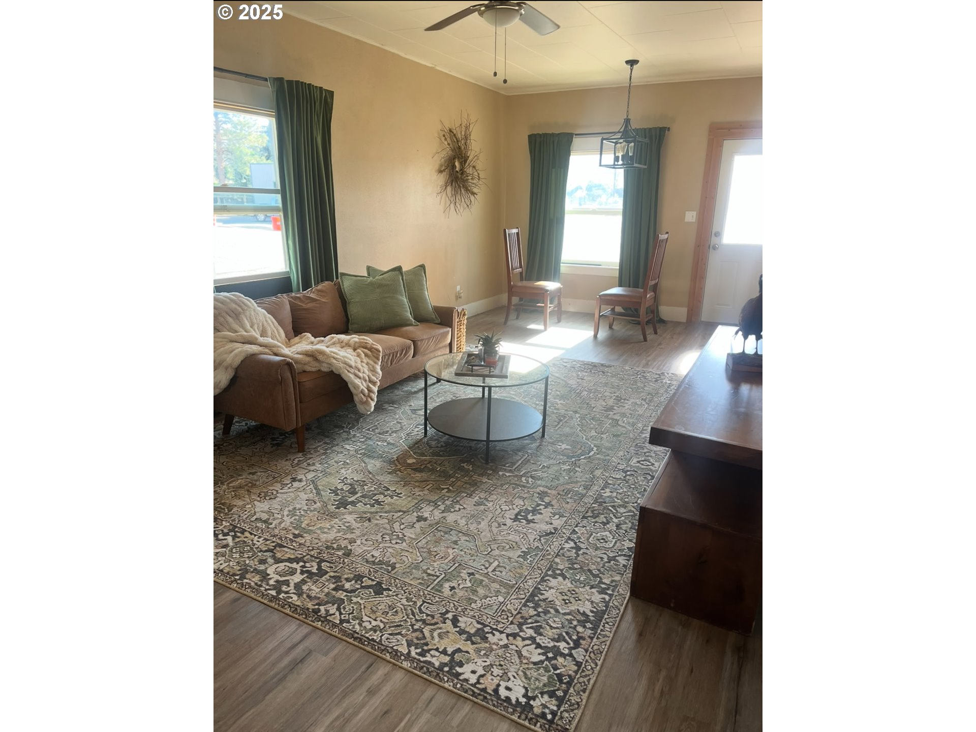 2800 10th Street Baker City, OR 97814 - Photo 21 of 23 a living room with furniture and a large window