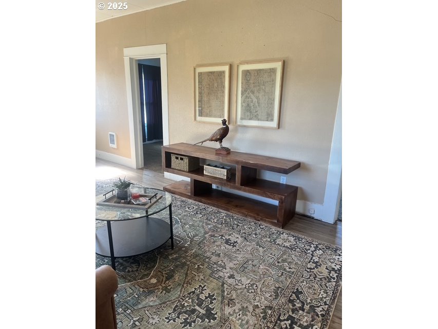2800 10th Street Baker City, OR 97814 - Photo 23 of 23 a living room with furniture and a potted plant