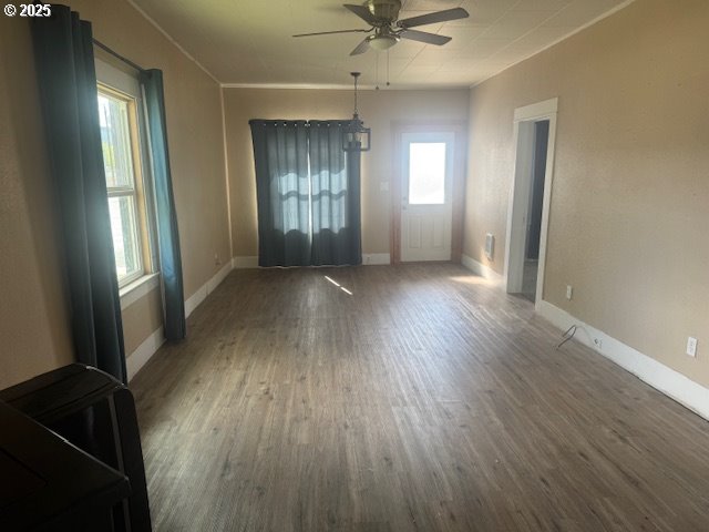 2800 10th Street Baker City, OR 97814 - Photo 7 of 23 an empty room with wooden floor and windows