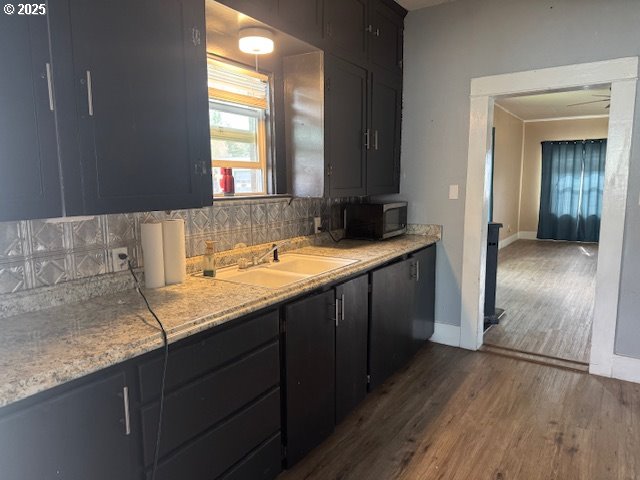 2800 10th Street Baker City, OR 97814 - Photo 10 of 23 a bathroom with a granite countertop sink and a mirror