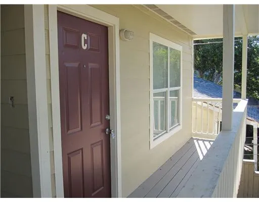 a view of front door with wooden floor