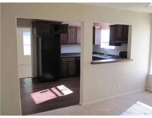 a kitchen with stainless steel appliances granite countertop a refrigerator and a microwave