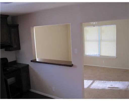a view of a kitchen that has a window
