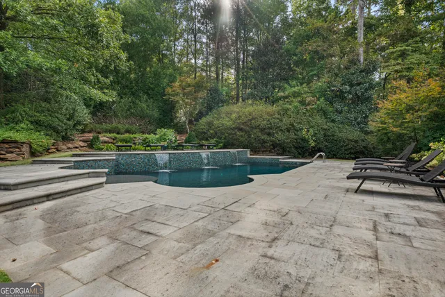 a room with gym equipment and a flat screen tv