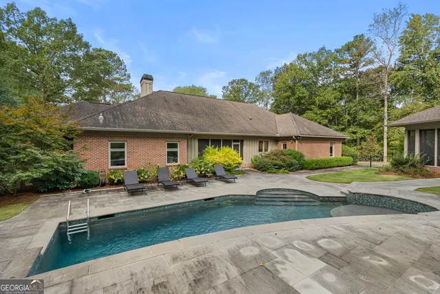 a living room with fireplace furniture and a flat screen tv