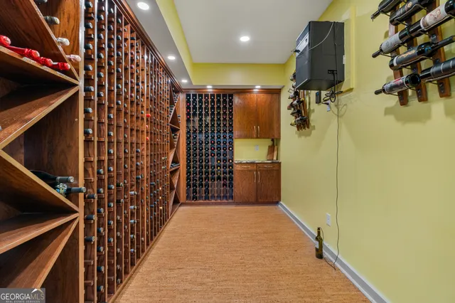 a living room with furniture a flat screen tv and a large window