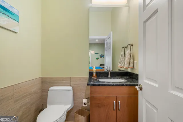 a bedroom with a bed and a table in it