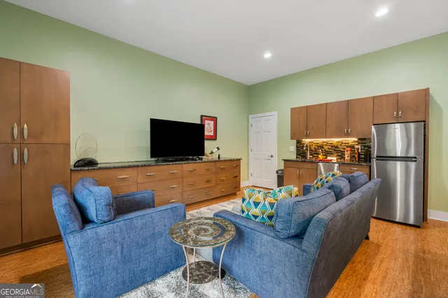 a bathroom with a granite countertop sink a toilet and a mirror