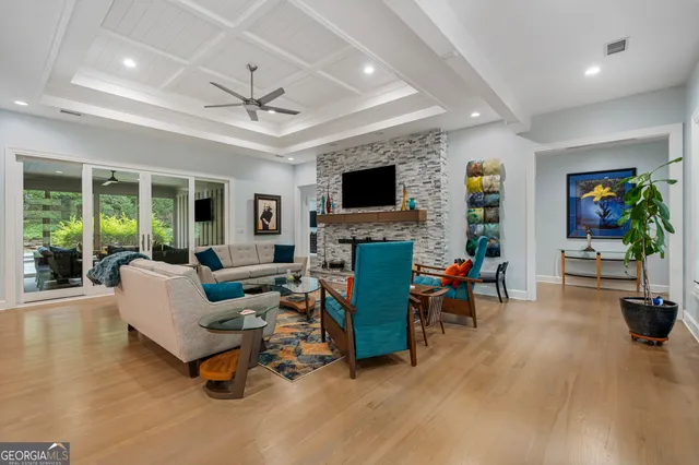 a kitchen with kitchen island granite countertop a large counter top stainless steel appliances and cabinets