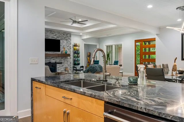 a living room with a bed furniture and a window