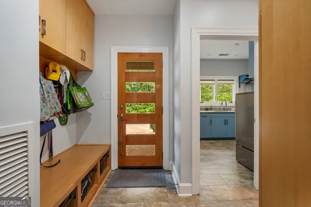 a large bathroom with a double vanity sink a mirror and a shower