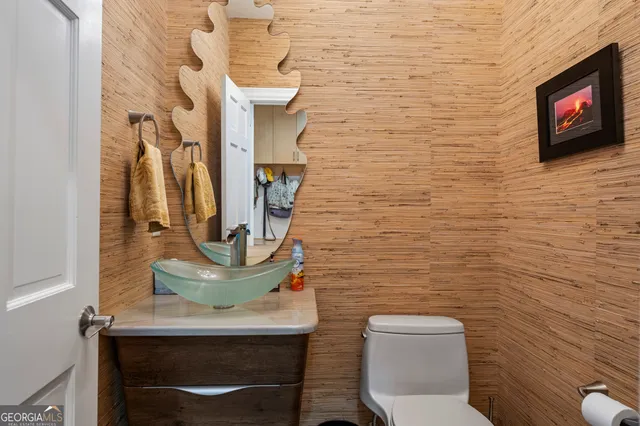 an aerial view of a house with yard