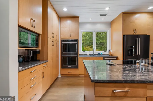 an aerial view of a house with a yard