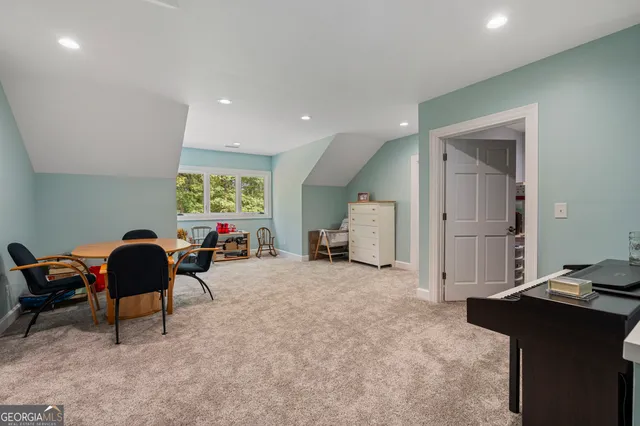 an aerial view of a house with yard