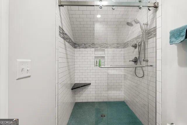 an aerial view of a residential house with a garden and yard