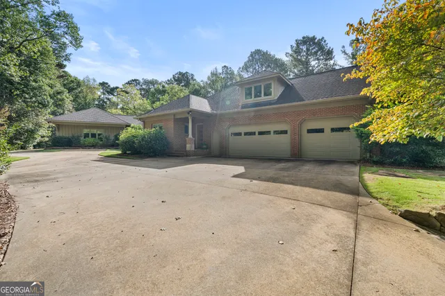 a room with furniture pool table and flat screen tv